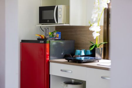 Kitchenette corner of a Garden Villa with microwave, mini fridge and tea and coffee set.